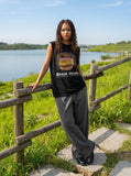 DAXUEN black oversized cartoon face cheeseburger print sleeveless top — model photo