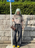 DAXUEN light pinkish-beige oversized cartoon graffiti cat graphic tee — model photo