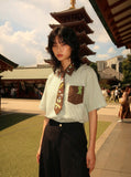 DAXUEN Short-sleeved button-up shirt with cartoon graphics — model photo