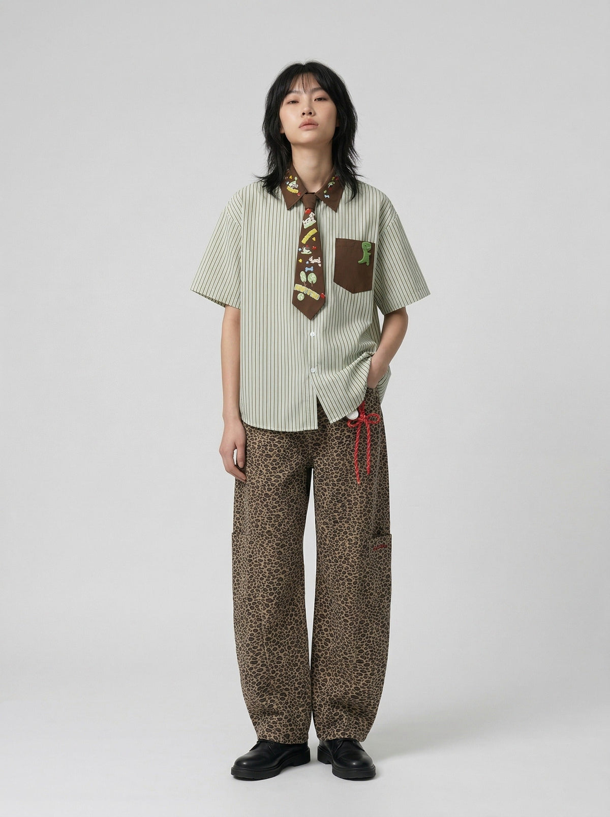DAXUEN Short-sleeved button-up shirt with cartoon graphics — model photo
