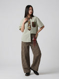 DAXUEN Short-sleeved button-up shirt with cartoon graphics — model photo