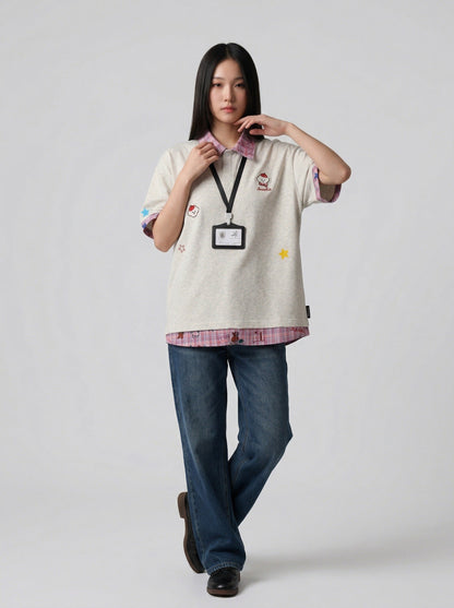 DAXUEN Layered polo shirt with cartoon graphics and plaid accents — model photo