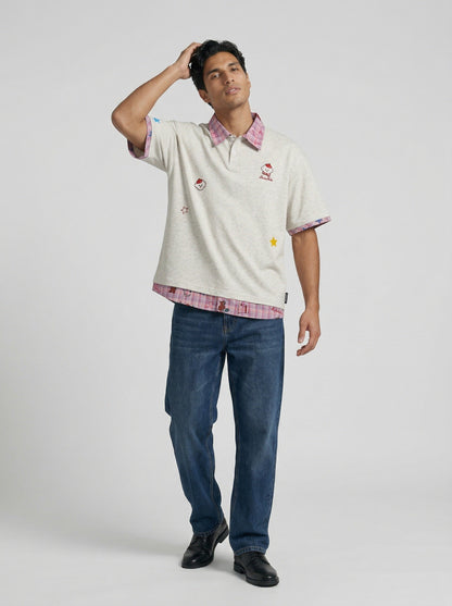 DAXUEN Layered polo shirt with cartoon graphics and plaid accents — model photo