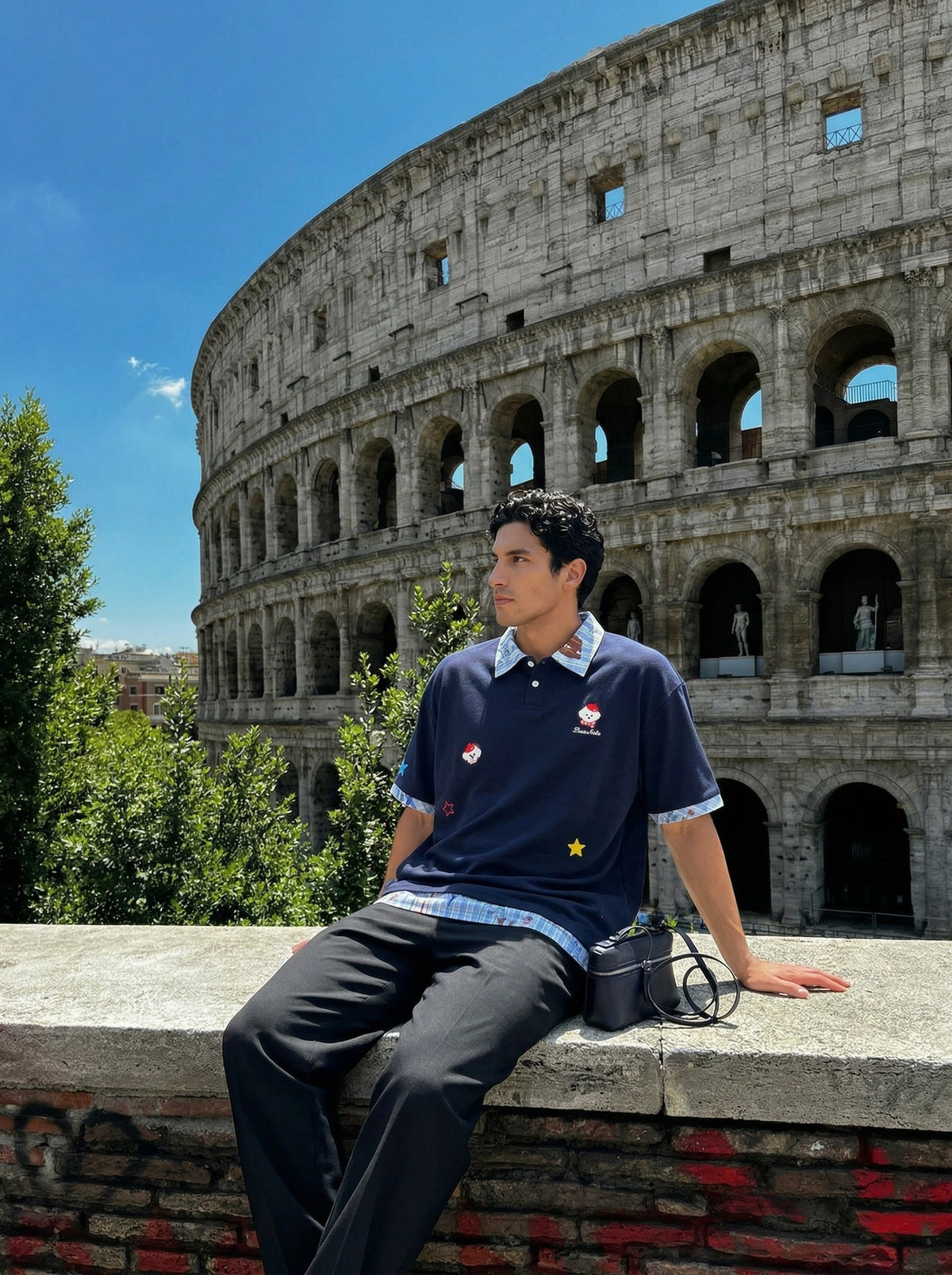 DAXUEN Layered polo shirt with cartoon graphics and plaid accents — model photo