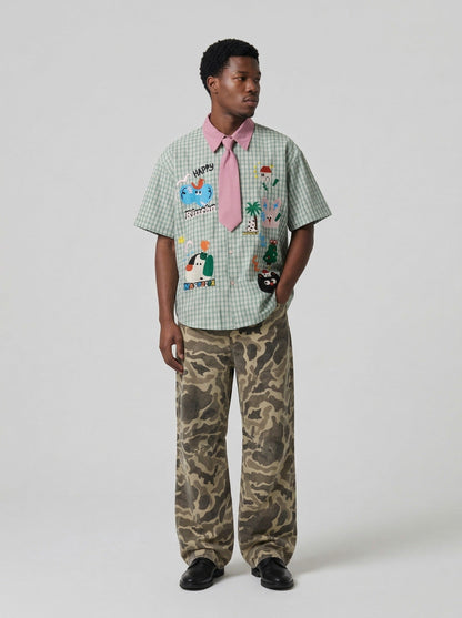 DAXUEN Short-sleeved collared shirt with plaid pattern and embroidery — model photo