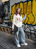 DAXUEN light grey oversized cartoon sun graphic long-sleeve crew top — model photo