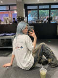 DAXUEN heather grey oversized cartoon surfboard graphic tee — model photo