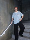 DAXUEN light blue cartoonish eternally embroidered henley tee — model photo