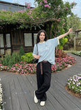 DAXUEN light blue cartoonish eternally embroidered henley tee — model photo