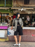 DAXUEN Knee-length casual shorts with rivet pockets — model photo