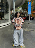 DAXUEN White short-sleeved T-shirt with cat graphic and colour blocking — model photo