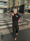 DAXUEN Oversized T-shirt with cat graphic and polka dot sleeves — model photo