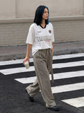 DAXUEN V-neck short-sleeved jersey top with graphic elements — model photo