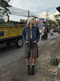 DAXUEN Charcoal grey wide-leg denim shorts with contrast stitching — model photo