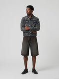 DAXUEN Charcoal grey wide-leg denim shorts with contrast stitching — model photo