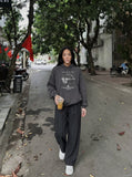 DAXUEN Wide-leg trousers in dark charcoal grey with pinstripes — model photo
