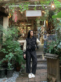 DAXUEN Wide-leg trousers in dark charcoal grey with pinstripes — model photo