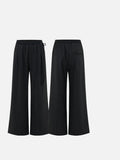 DAXUEN Women's black pinstripe wide-leg pants — model photo