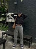 DAXUEN Relaxed fit bomber jacket in black and burgundy — model photo