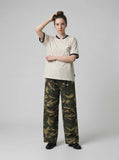 DAXUEN Short-sleeved henley-style T-shirt with graphic pocket — model photo