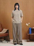DAXUEN Short sleeve knitted polo shirt in black and light beige — model photo