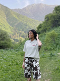 DAXUEN Light grey oversized polo shirt with red embroidery — model photo