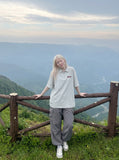 DAXUEN Light grey oversized polo shirt with red embroidery — model photo