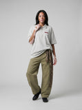 DAXUEN Light grey oversized polo shirt with red embroidery — model photo