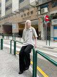 DAXUEN Light grey oversized polo shirt with red embroidery — model photo