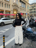 DAXUEN Wide-leg lounge pants with snowflake print — model photo
