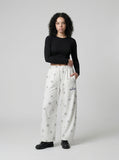 DAXUEN Wide-leg lounge pants with snowflake print — model photo