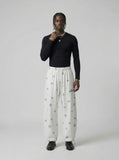 DAXUEN Wide-leg lounge pants with snowflake print — model photo