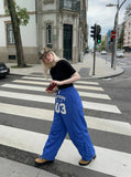 DAXUEN Loose-fitting wide-leg track pants with graphics — model photo