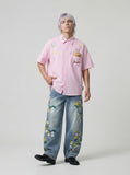DAXUEN Relaxed-fit short-sleeve button-up shirt with bear pocket — model photo