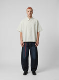 DAXUEN Cream striped button-up shirt with short sleeves — model photo