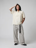 DAXUEN Oversized short-sleeve polo shirt with pocket — model photo