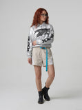 DAXUEN Relaxed-fit shorts with ruched waistband and webbing belt — model photo
