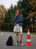 DAXUEN Relaxed-fit shorts with ruched waistband and webbing belt — model photo