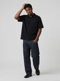 DAXUEN Short-sleeved polo shirt in light grey melange and black — model photo