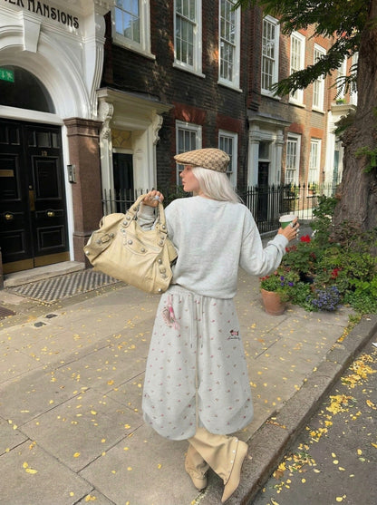 DAXUEN Wide-leg sweatpants with playful prints and embroidery — model photo
