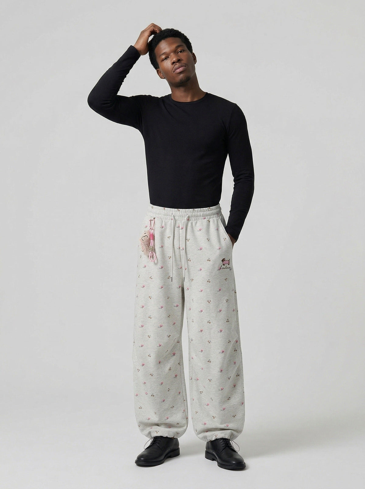 DAXUEN Wide-leg sweatpants with playful prints and embroidery — model photo