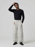 DAXUEN Wide-leg sweatpants with playful prints and embroidery — model photo