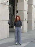 DAXUEN Wide-leg gingham pants with elastic waistband — model photo