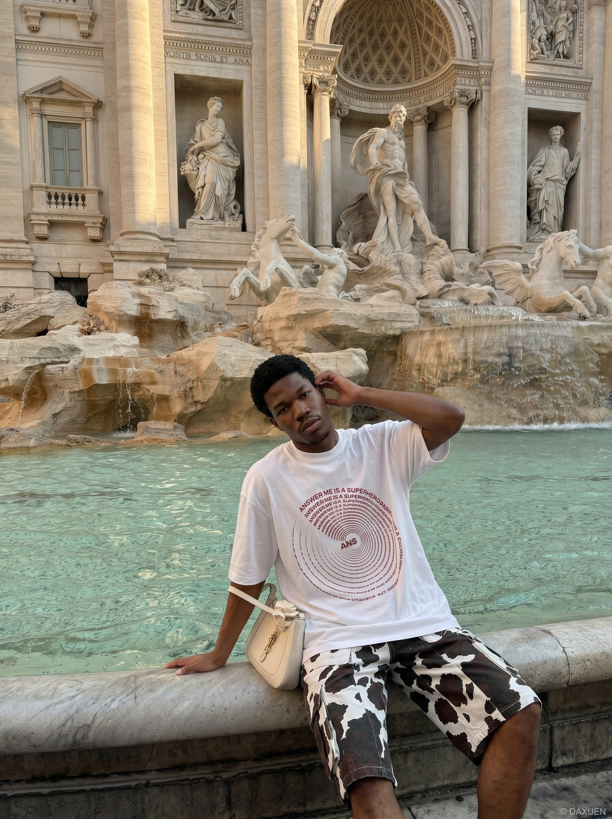 DAXUEN black oversized circular red text graphic tee — model photo
