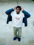 DAXUEN black oversized circular red text graphic tee — model photo