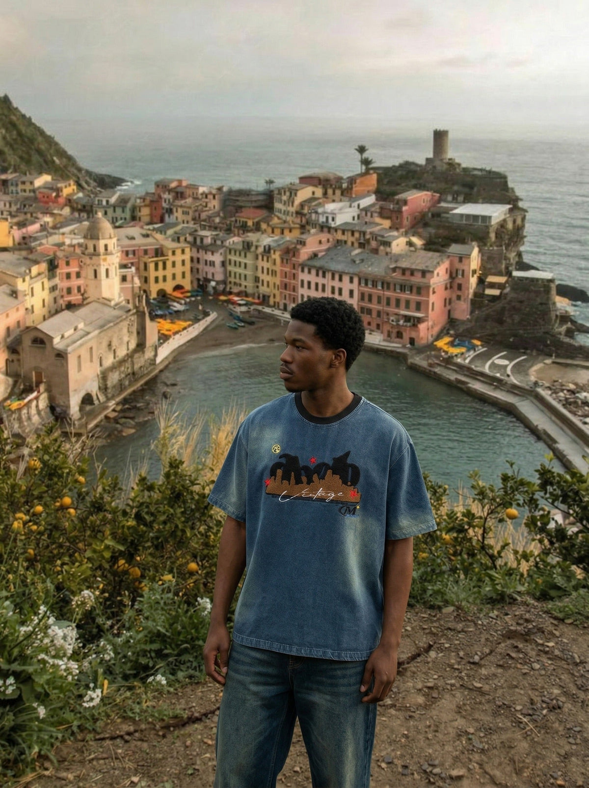 DAXUEN Embroidered denim t-shirt with cityscape design — model photo