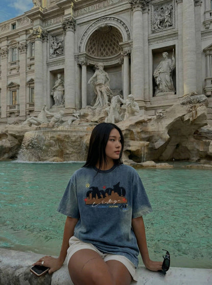 DAXUEN Embroidered denim t-shirt with cityscape design — model photo