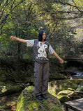 DAXUEN black oversized cloud-rabbit graphic t-shirt — model photo