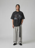 DAXUEN dark grey oversized collage graphic tee — model photo