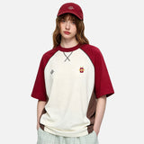 DAXUEN Loose-fit color-block raglan t-shirt with embroidered details
